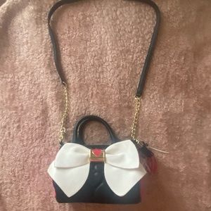 Betsey Johnson crossbody bag with bright pink, quilted hearts